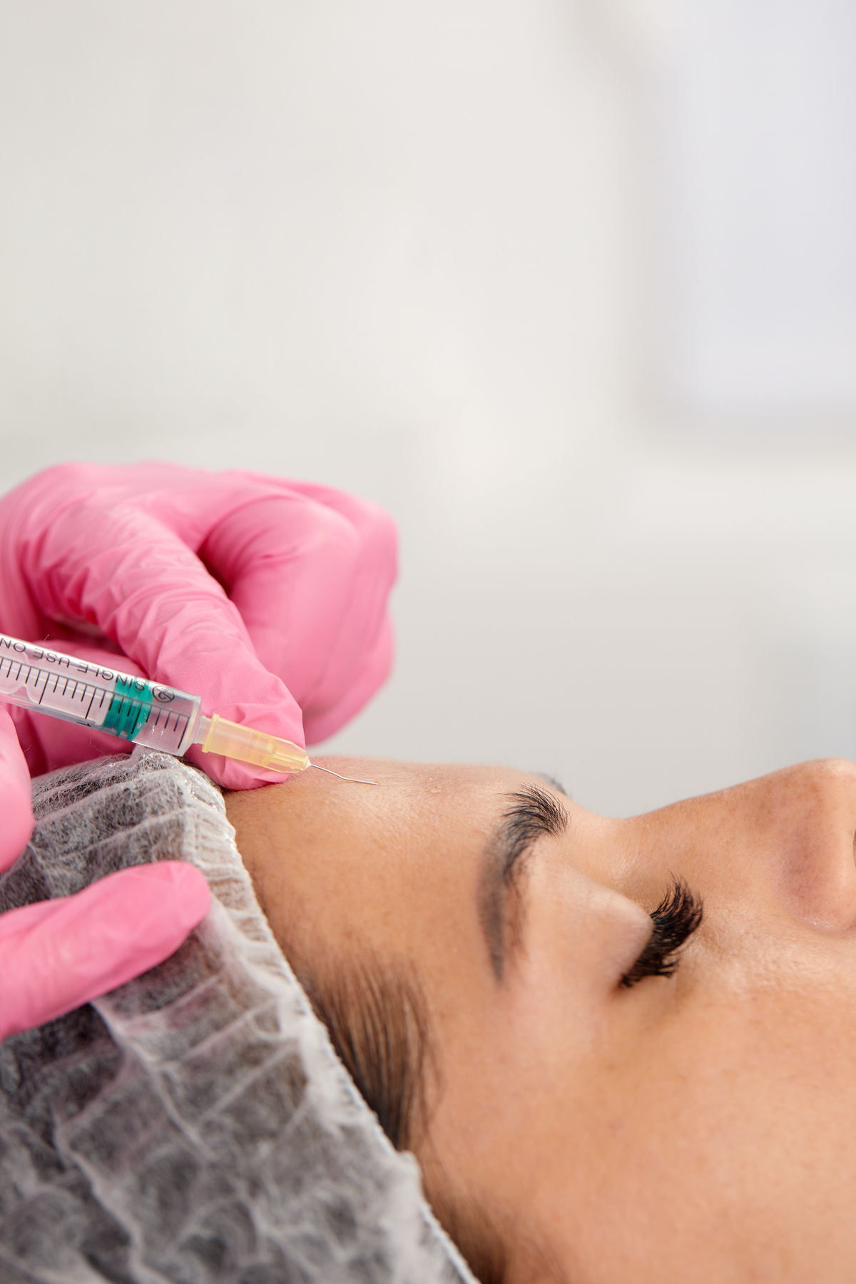 portrait of young woman getting tox treatments